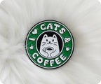 Circular badge with 'I ❤️ Cats & Coffee' text and a cat illustration on a white fluffy background © Tigoli® 2026 All Rights Reserved Panda Loco Ltd 